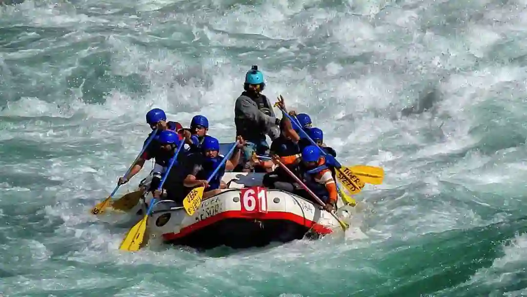 Group of 8 people rafting in a high current