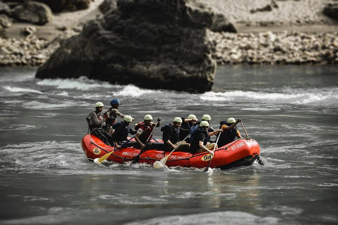 A group of 8 people rafting in Rishikesh during winter season