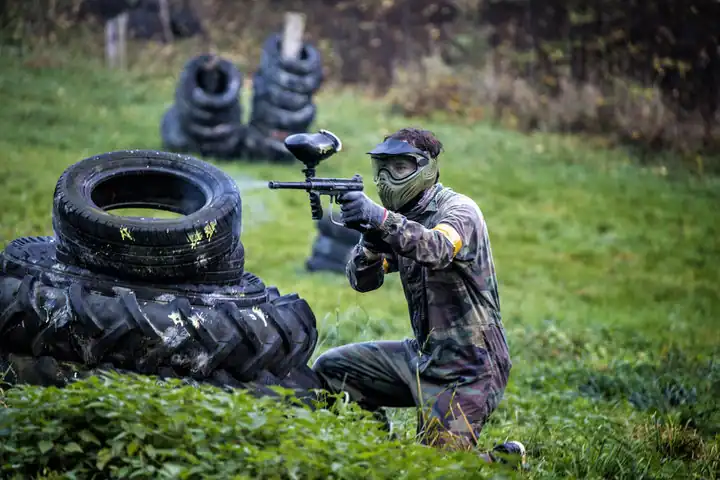 A man shooting with paintball